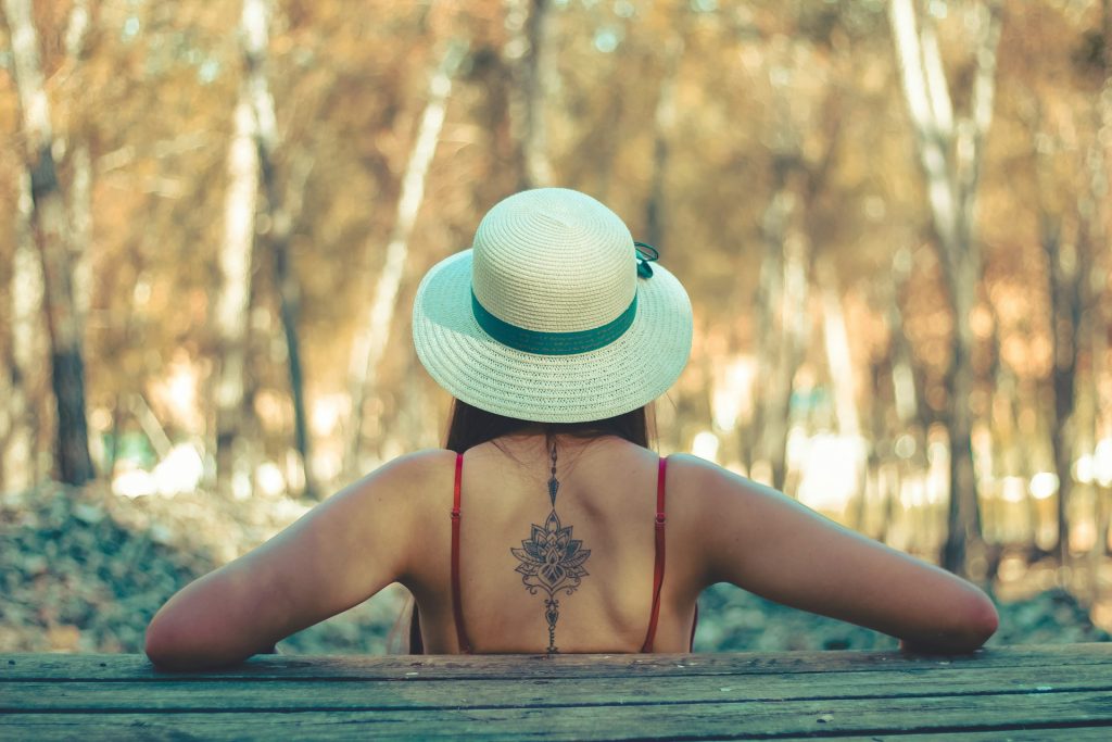 woman with new tattoo in the park